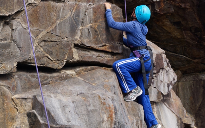 teens learn rock climbing skills in maine
